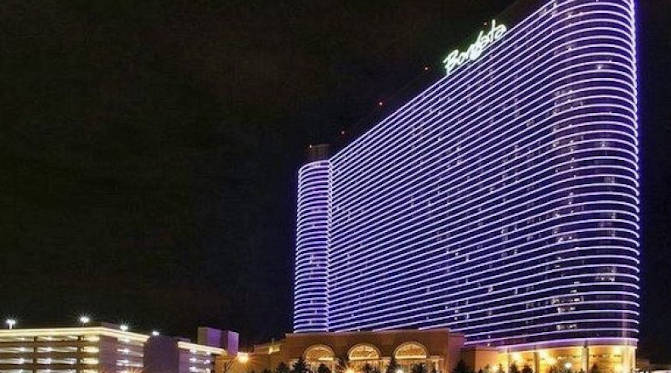 The Borgata Atlantic City Casino glowing in purple to set itself apart from Atlantic City's busy casino venues.